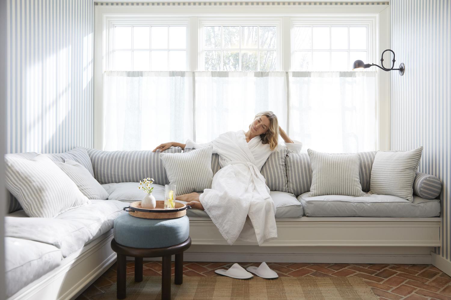 Woman in robe on the couch