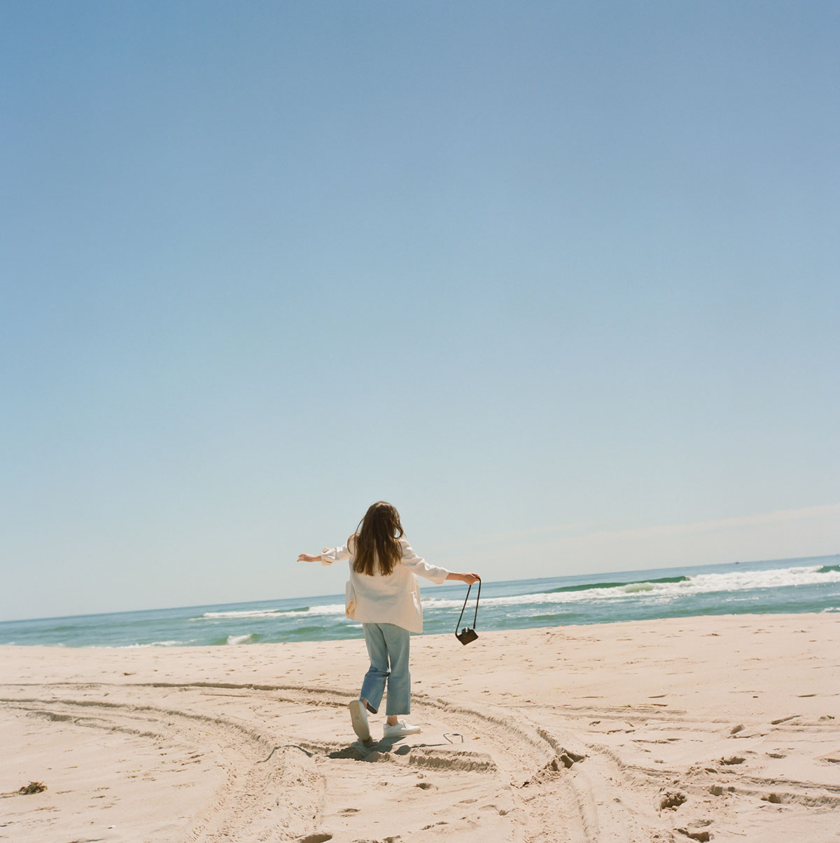 Woman walking on the beach