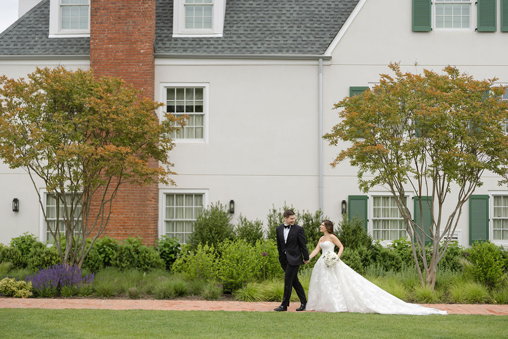 Bride and groom walking grounds